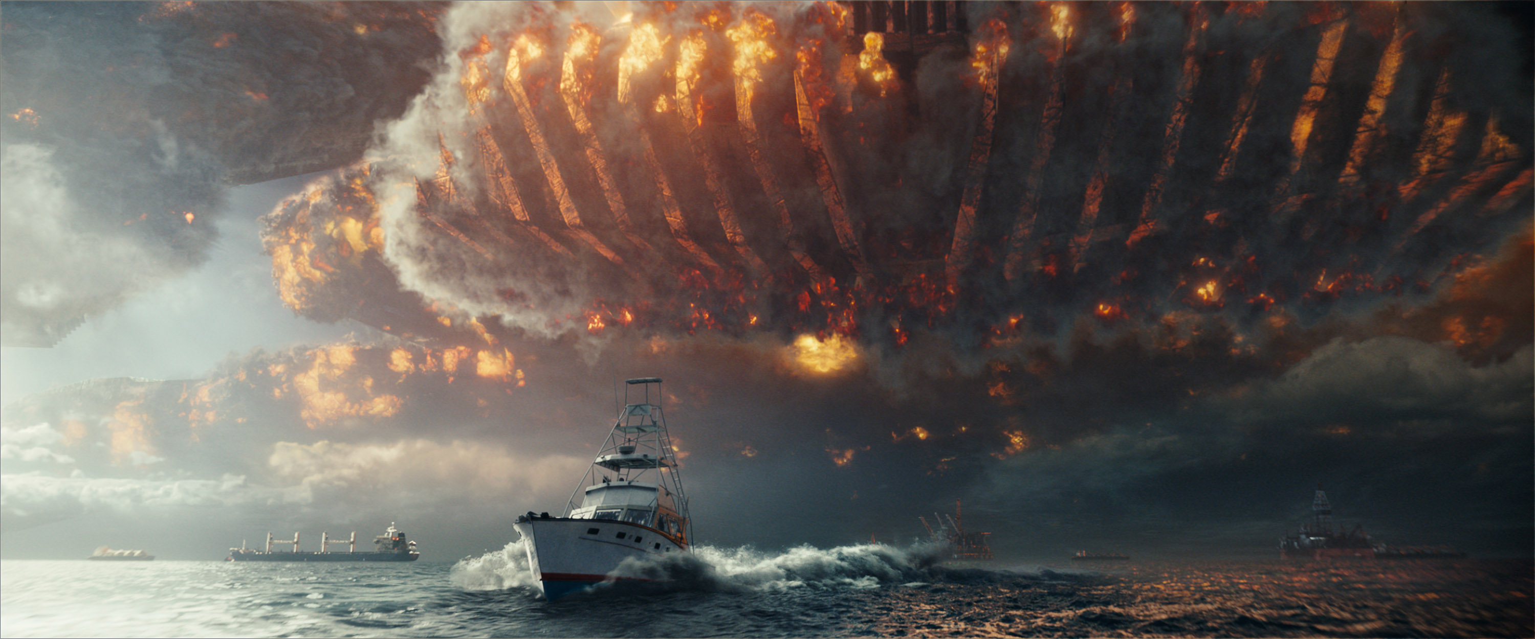 ID2_TR1_000_0110_ref_still-comp-01048_v0014r - An alien ship wreaks havoc in the skies above a fleeing ship. Photo Credit: Courtesy Twentieth Century Fox.